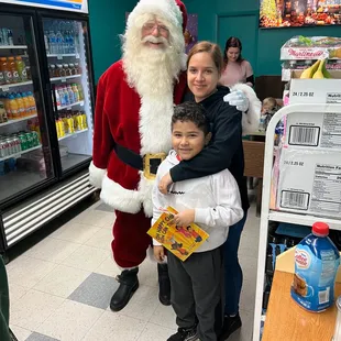 a man dressed as santa claus with a child