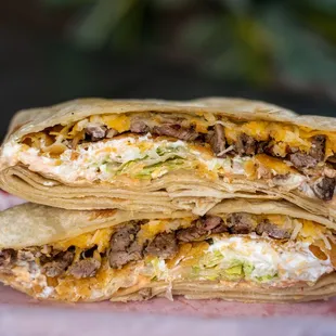 two burritos stacked on top of each other