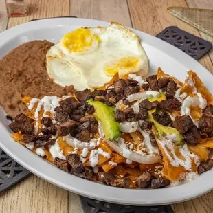 Chilaquiles plate with beef fajita