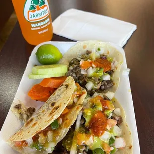 Bean taco on left and two steak/cheese/peppers tacos.. and condiments from minibar! AMAZING