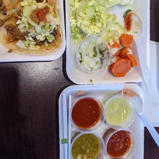 two trays of food on a table