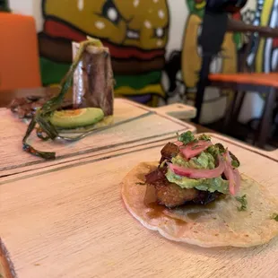 Pork belly taco and skelator taco