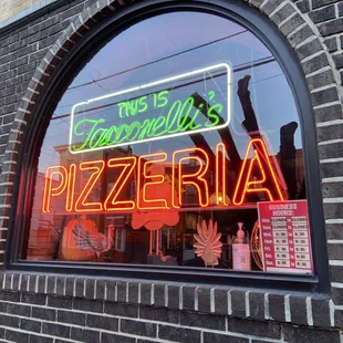 a neon sign in the window