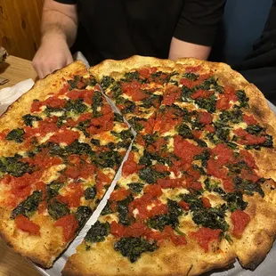 Specialty pizza (spinach and tomato)