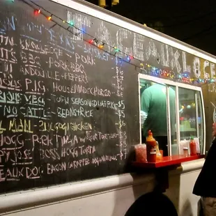 a chalkboard with a menu written on it