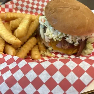Double cheeseburger with onion bacon and slaw.