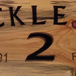 a close up of a wooden sign