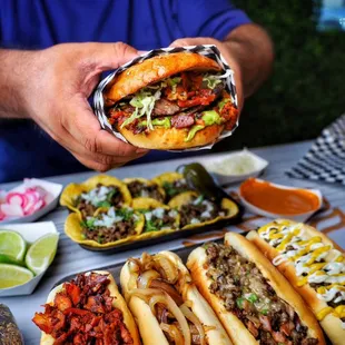 a man holding a hot dog