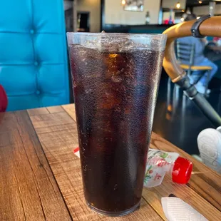 a cold drink in a tall glass