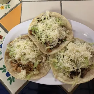 Chicken taco, carne asada taco, and pastor taco