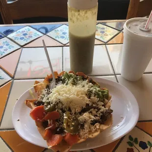 Steak taco salad, medium hot sauce, and fountain drink!