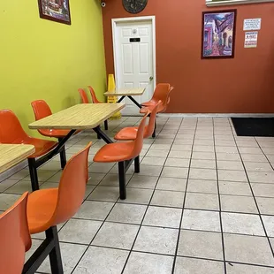 tables and orange chairs
