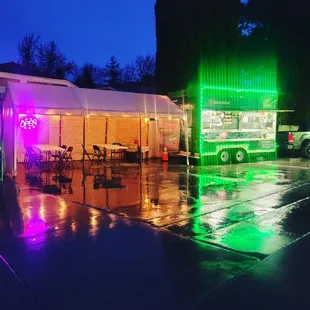 a food truck with neon lights