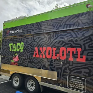 a taco truck parked in a parking lot