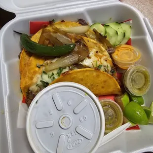 Quesabirria with the consome and fixings