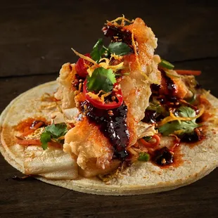 a chicken taco on a tortilla