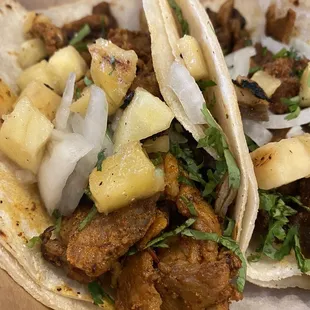 Al pastor pork tacos with pineapple. Lean cuts of flavorful pork, no fat.