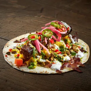 AFGHAN VAN DAMME

Beef Koobideh, Garlic Yogurt, Cilantro Chutney, Pistachio Rice, Pickled Onion, Chiles, Currants, Chihuahua Cheese