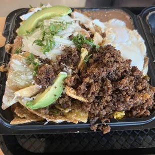 Chilaquiles with chorizo - huge portion and worth it 100%