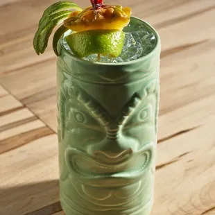 A specialty cocktail in a tiki mug