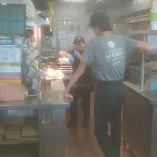 Prepping our food while on her cell phone! What&apos;s the point of gloves? She reached into a bin of hasbrowns too WITH THE SAME GLOVE ON!