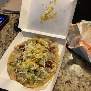 Mexican Pizza, smushed to the top and has lettuce