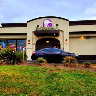 a car parked outside of a restaurant