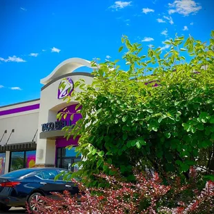a car parked in front of a restaurant
