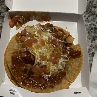 Messy Mexican Pizza, broken shell, skimpy uneven toppings...would you be proud to serve this?