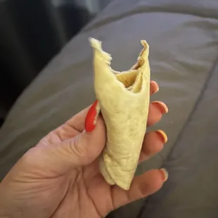 This is the bottom half of my bean and cheese burrito with sour cream. It's the size of a roll up, and has no sour cream.