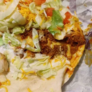 Soft taco sloppily made with no very little meat