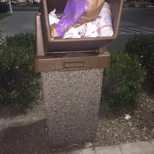 An overflow trash cans at the drive-through always drives me crazy.