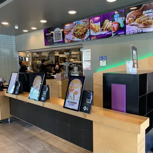 the counter and menus of a fast food restaurant