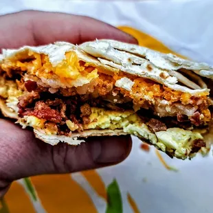 Breakfast Crunchwrap®: bacon, real cheddar cheese, scrambled eggs, and hash brown wrapped in a warm tortilla.