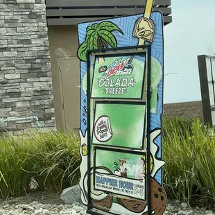 a sign in front of a building