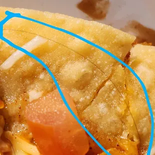 What is in the circle is a hair baked into the Mexicsn Pizza