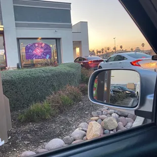 a view of a taco bell from a car window
