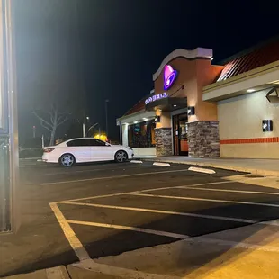 a white car parked in a parking lot