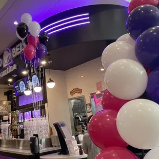 a bar decorated with balloons