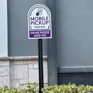 a mobile pickup parking sign