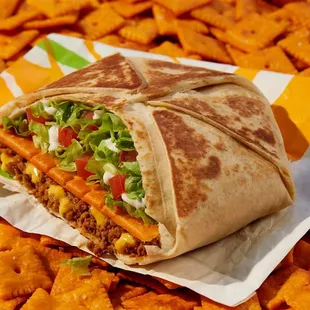 a burrito with cheese and lettuce