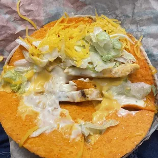 Chicken cheesy gordita crunch with Dorito she'll add nacho cheese but no nacho cheese or lettuce