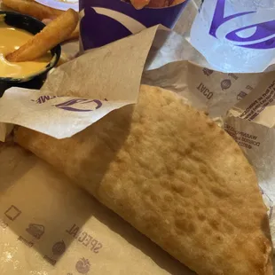 Chualpa sumpreme and nacho fries chesse dip and soda drink