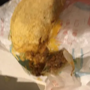 Tacos stuck to wrapping like this one crammed into a sack broken and falling apart