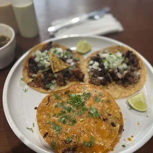 two tacos on a white plate