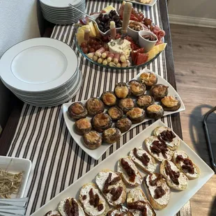 A client asked for a custom menu with a variety of hors d'oeuvres including a charcuterie tray, crab stuffed mushrooms, and  more.