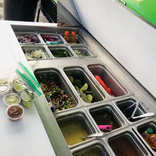 Salsas and veggies to pick from. Nice, clean, and really cold.