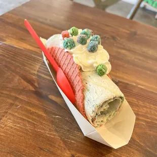 Cap&apos;n Crunch sweet rolled taco with a pink shell.