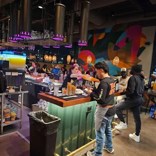 a group of people in a restaurant