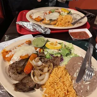 Dinner tampiquena plate. It's huge! And delicious! Comes w asada and 2 chicken enchiladas. Def tastes like home cooking!